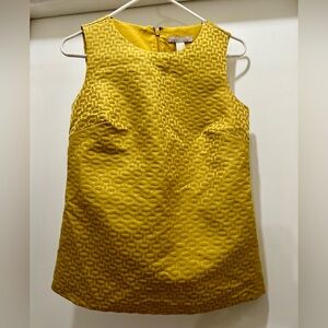 Mustard yellow jacquard blouse.